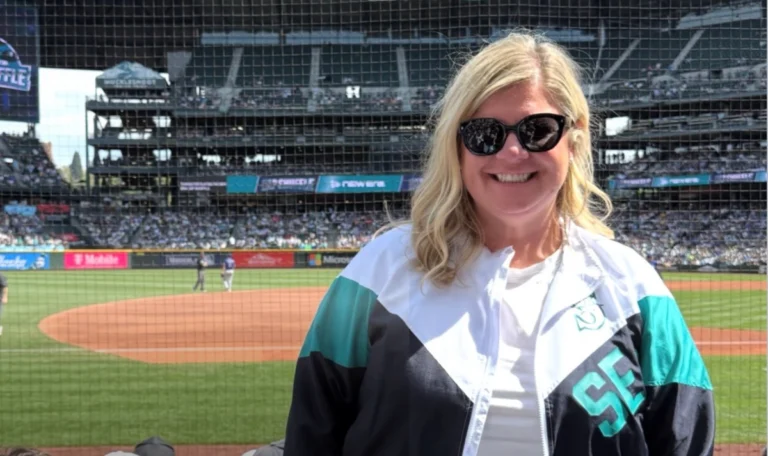 Hillary Schmidt standing on Mariners Baseball field