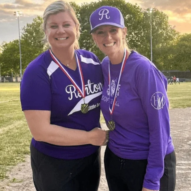 Hillary Schdmit (L) and another coach (R) of the softball team